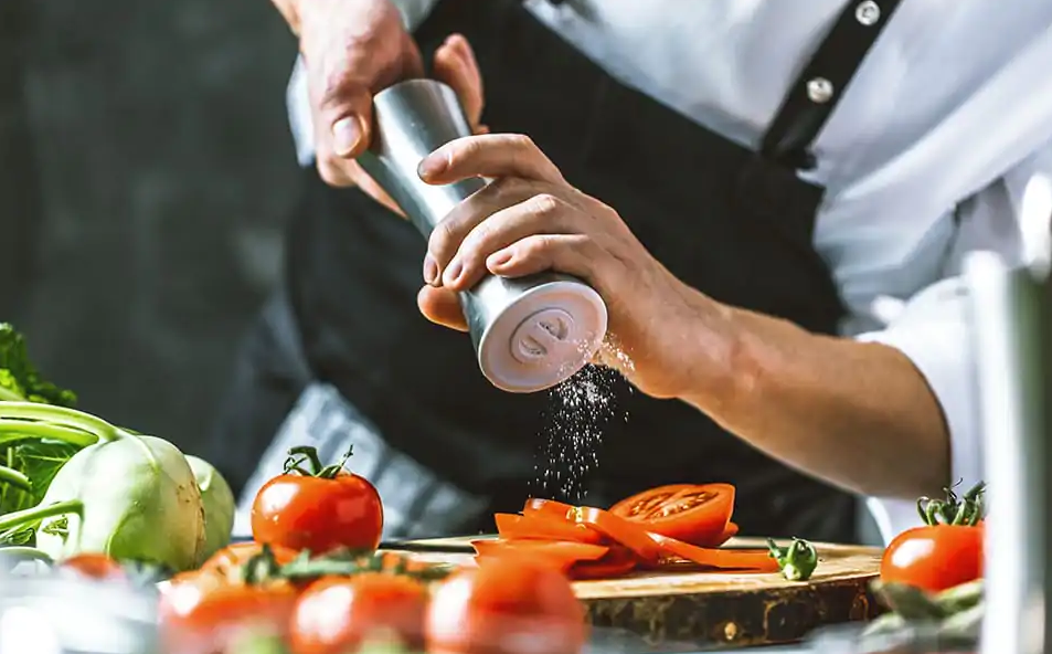 A chef in 1001 Nights luxury sustainable Arab restaurant preparing sustainable food